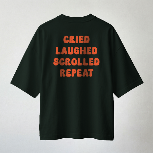 Dark green oversized t-shirt with “cried laughed scrolled repeat” bold statement back