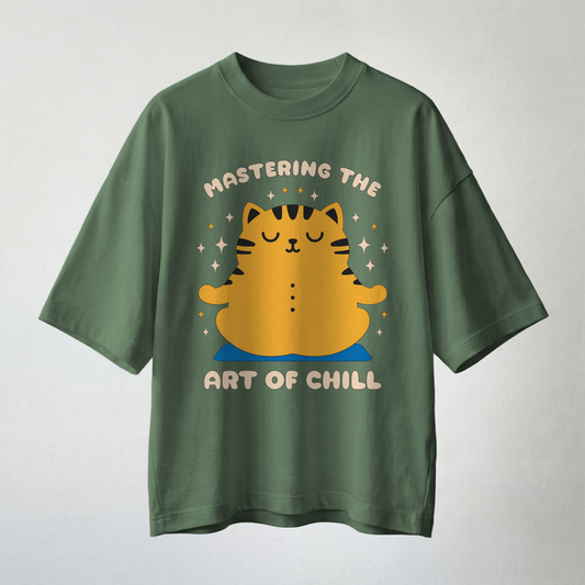 Green oversized t-shirt with “Mastering the Art of Chill” meditating cat graphic