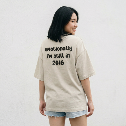 Woman wearing beige oversized t-shirt with emotional text back view relaxed fit