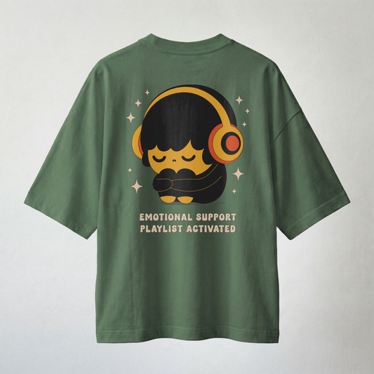 Green oversized t-shirt with Emotional Support Playlist Activated graphic print featuring cute character with headphones