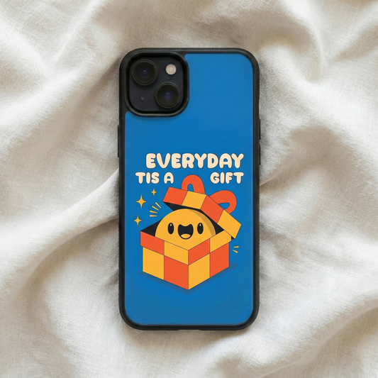 Everyday Is A Gift blue glass iPhone case by Spiritual Kalakaar with smiling gift illustration placed on soft fabric