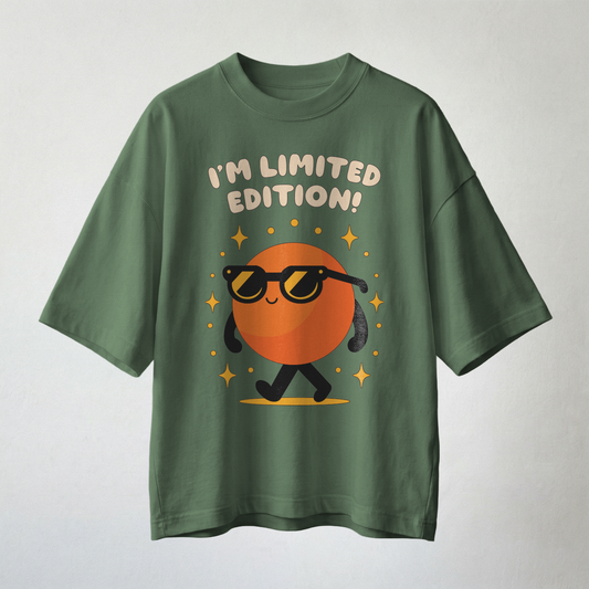 Green oversized t-shirt with cool orange character wearing sunglasses and text “I’m Limited Edition”