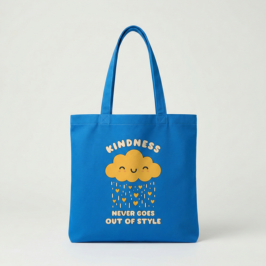 Blue canvas tote bag with “Kindness Never Goes Out of Style” smiling cloud illustration, aesthetic everyday shoulder bag