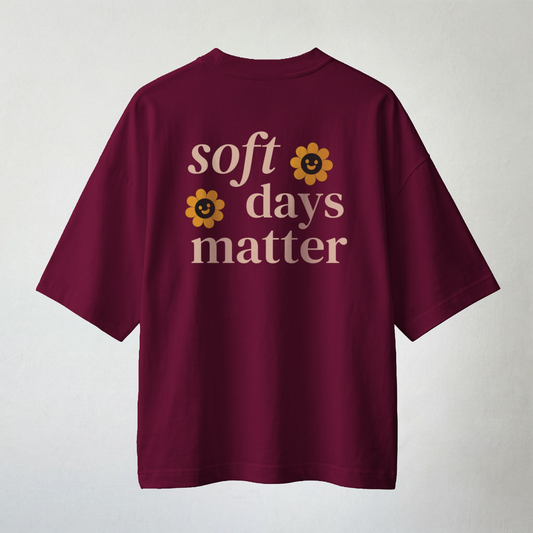 Maroon oversized t-shirt back print with “soft days matter” text and cute flower graphics