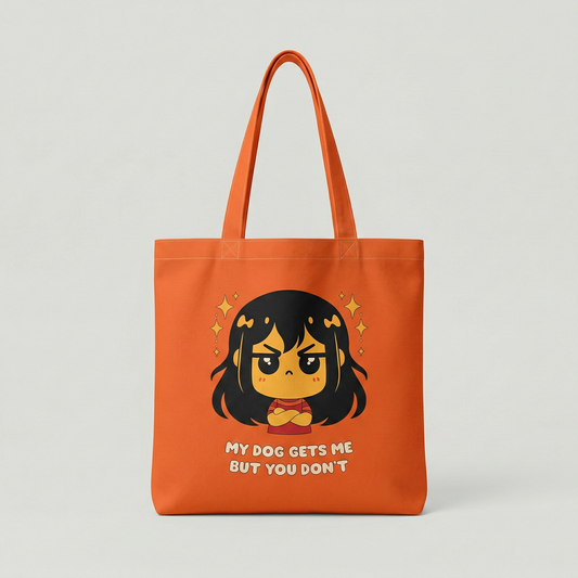 Orange canvas tote bag with “My Dog Gets Me But You Don’t” cute character illustration, funny everyday shoulder bag