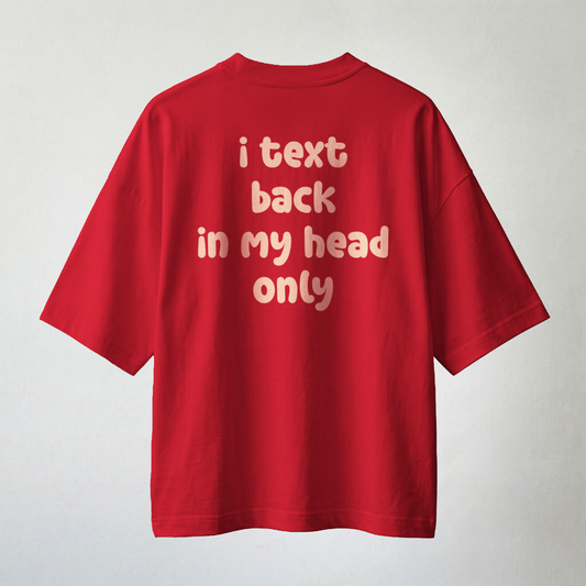Red oversized t-shirt back print with text “i text back in my head only” minimal cute typography